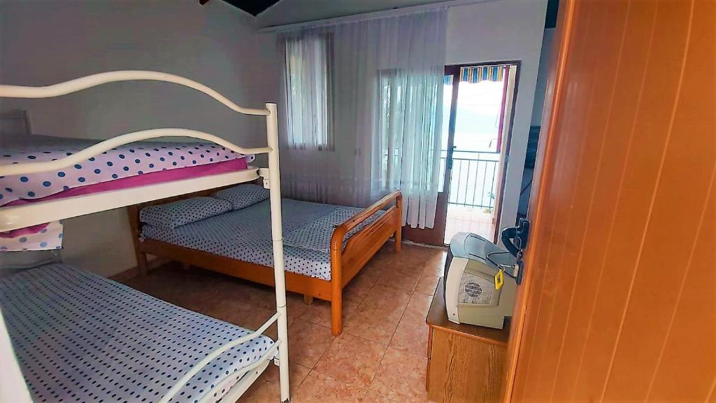 Fourth Room of Cozy Beachside Haven - Panoramic Radhime Retreat with Balcony Dining - Image 2