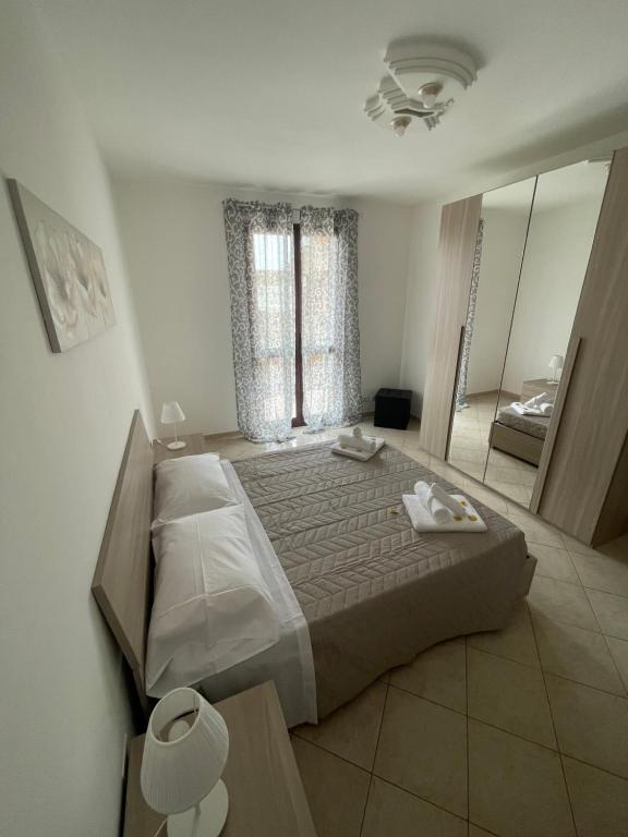 Postel nebo postele na pokoji v ubytování FlorAngè guest house