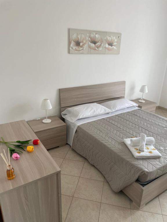 Postel nebo postele na pokoji v ubytování FlorAngè guest house