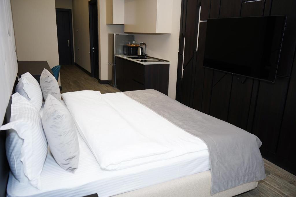 Postel nebo postele na pokoji v ubytování SOHO Hotel City Centre