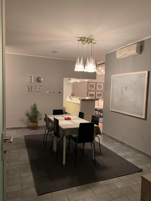 a dining room with a table and chairs at Apollo Apartaments in Zagreb