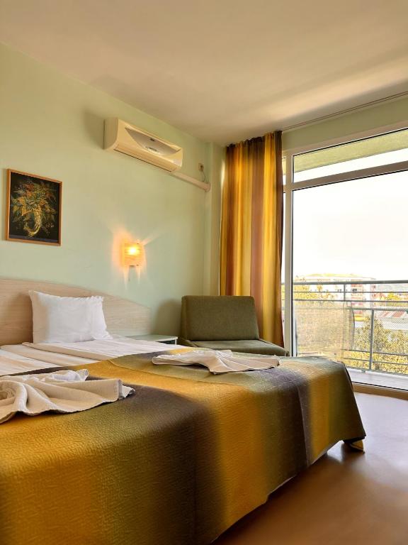 Postel nebo postele na pokoji v ubytování Hotel Boomerang - Sunny Beach