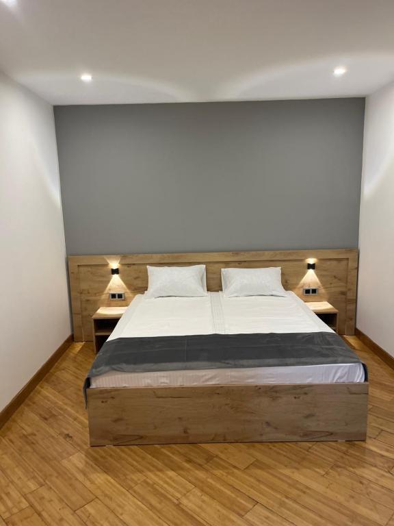 Postel nebo postele na pokoji v ubytování Friendly Hotel