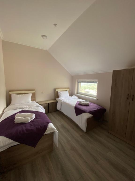 Postel nebo postele na pokoji v ubytování ANGINE Resort Hotel
