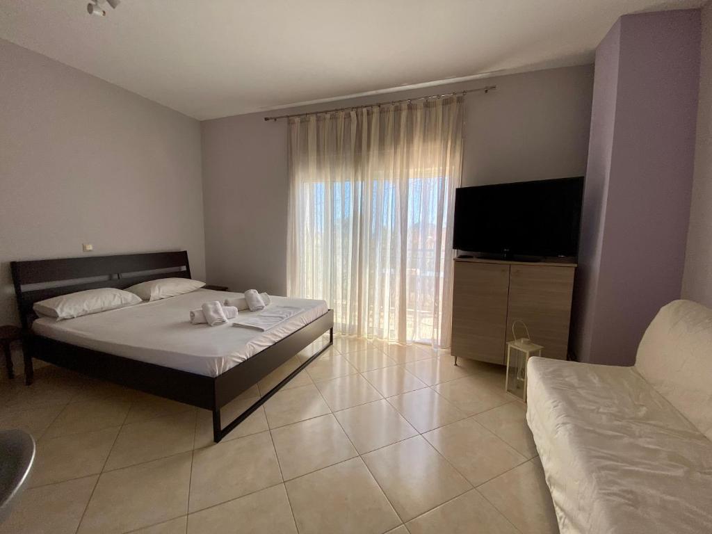 Postel nebo postele na pokoji v ubytování NikLuDin suites & studios