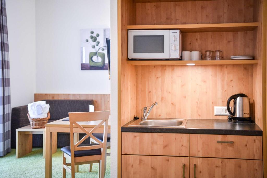 Kuchyň nebo kuchyňský kout v ubytování Burg Hotel Feldberg