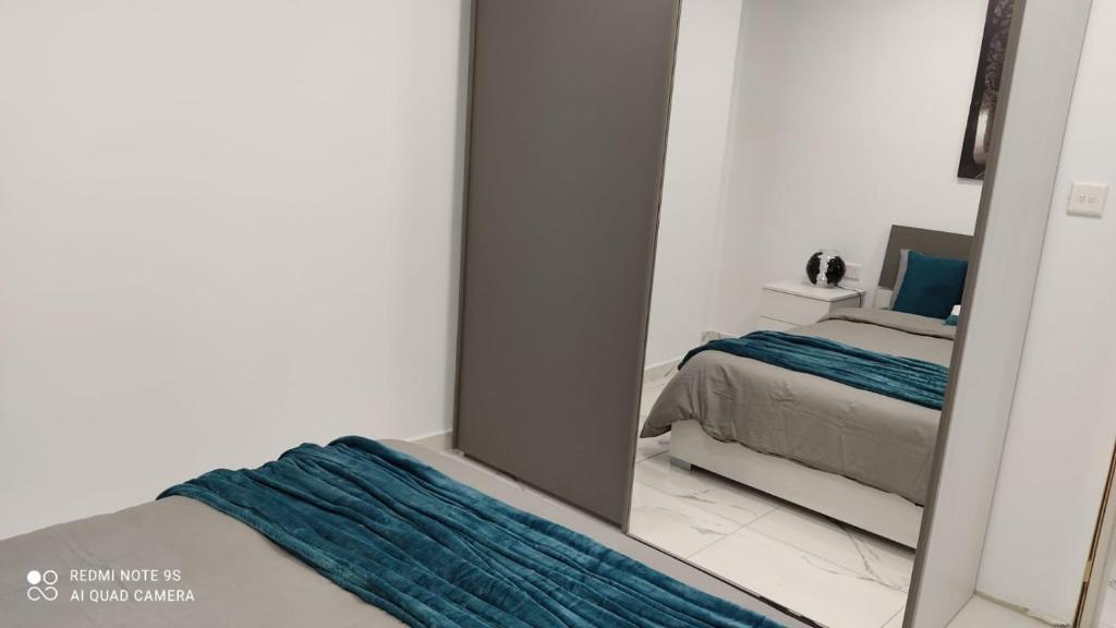 Postel nebo postele na pokoji v ubytování 10 Msida Park Residence