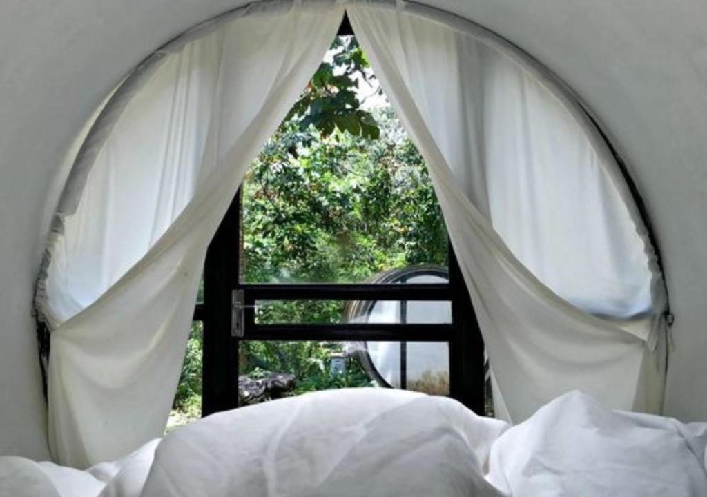 Voodi või voodid majutusasutuse Time Capsule Retreat, Sungai Lembing toas