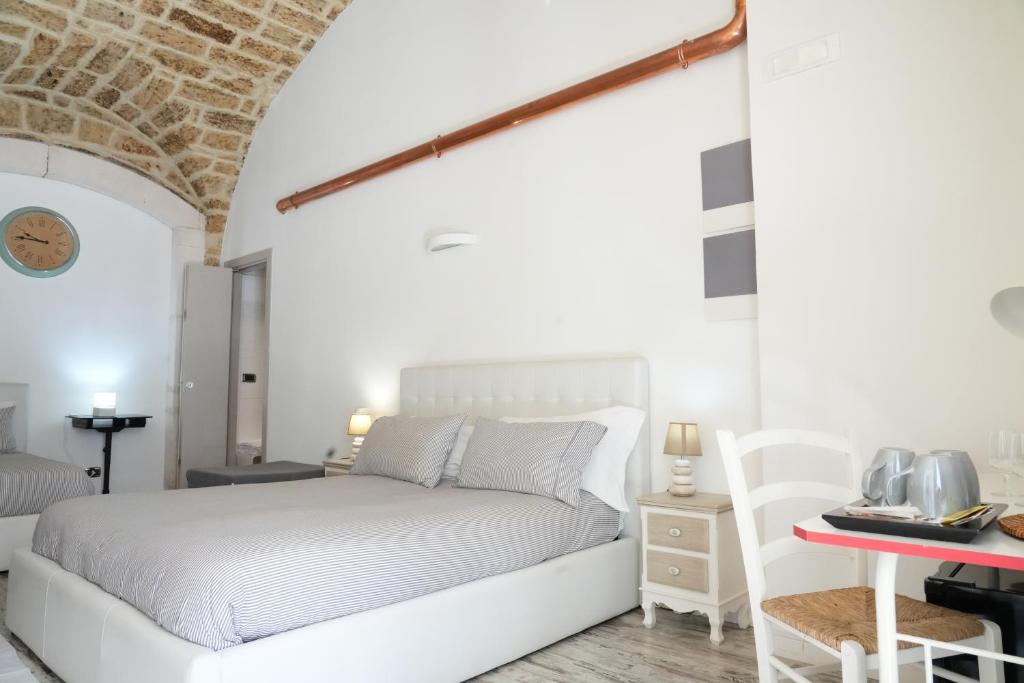 A bed or beds in a room at B&B Il Grifone