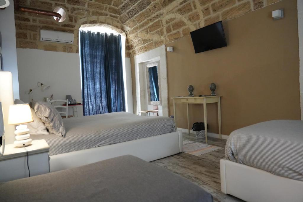 A bed or beds in a room at B&B Il Grifone