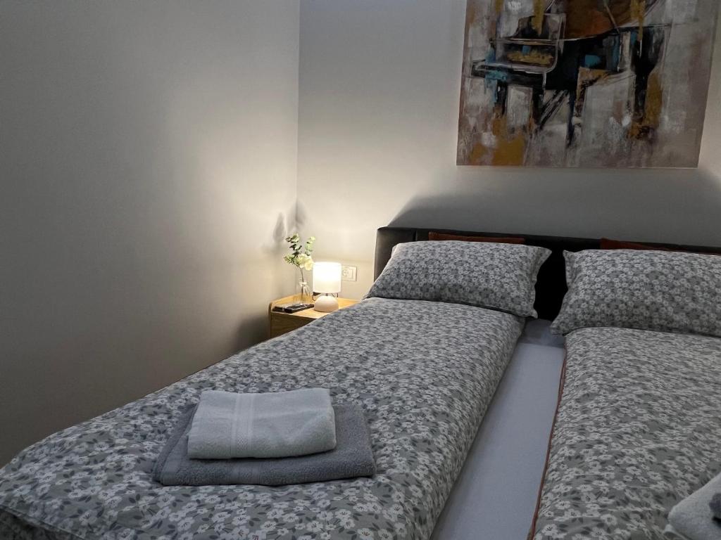 En eller flere senger på et rom på Apartman Time out 1