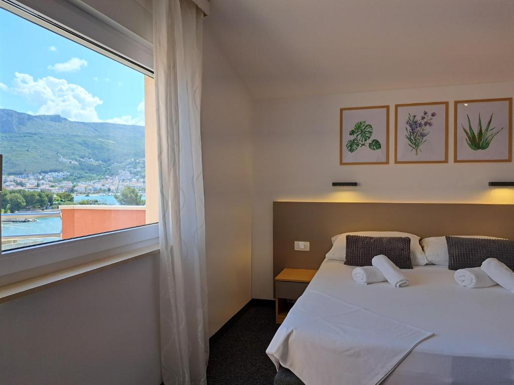 Postel nebo postele na pokoji v ubytování Rooms Zvonimir