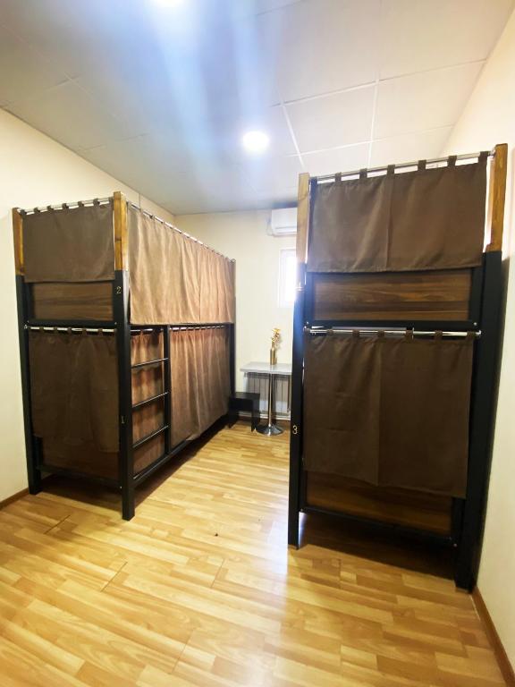 Postel nebo postele na pokoji v ubytování Domino Yerevan Hostel And Hotel