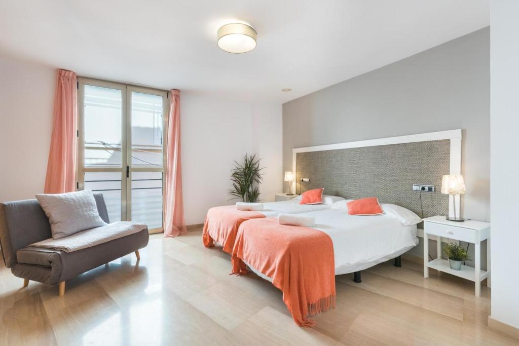 Posteľ alebo postele v izbe v ubytovaní APARTAMENTO MODERNO CALLE LARIOS