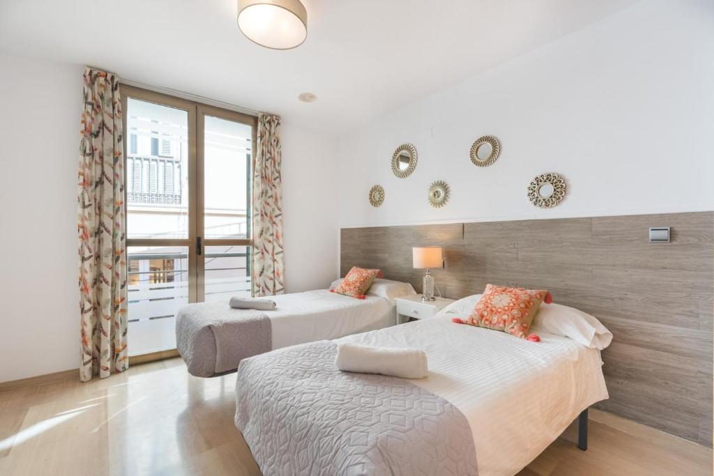 Posteľ alebo postele v izbe v ubytovaní APARTAMENTO MODERNO CALLE LARIOS