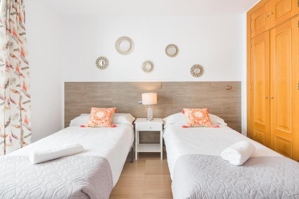 Posteľ alebo postele v izbe v ubytovaní APARTAMENTO MODERNO CALLE LARIOS