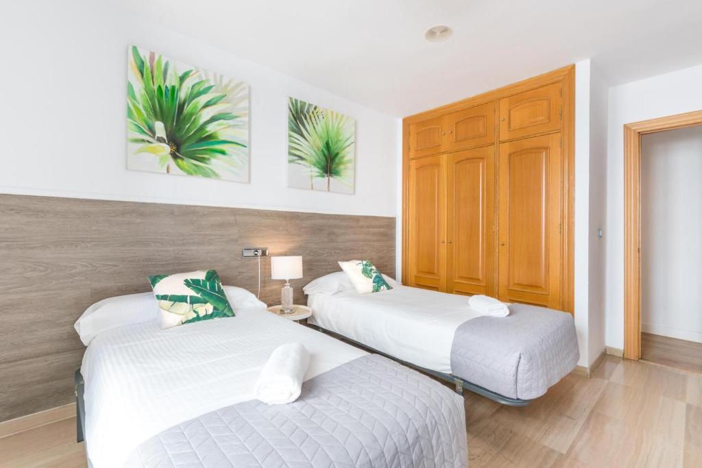 Posteľ alebo postele v izbe v ubytovaní APARTAMENTO MODERNO CALLE LARIOS