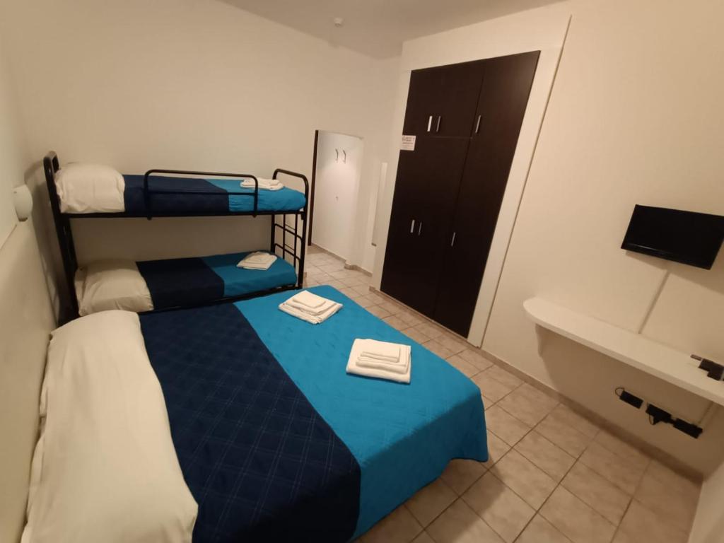 Postel nebo postele na pokoji v ubytování Hotel La Torre