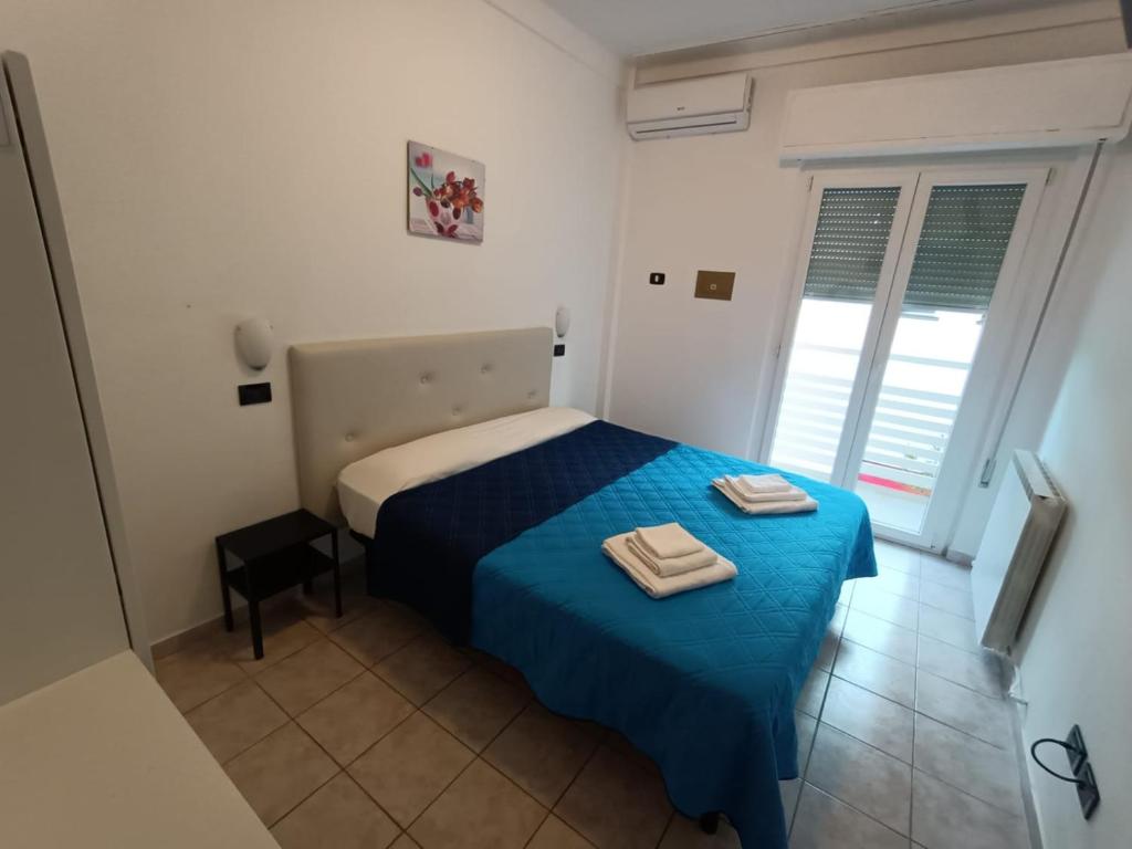 Postel nebo postele na pokoji v ubytování Hotel La Torre