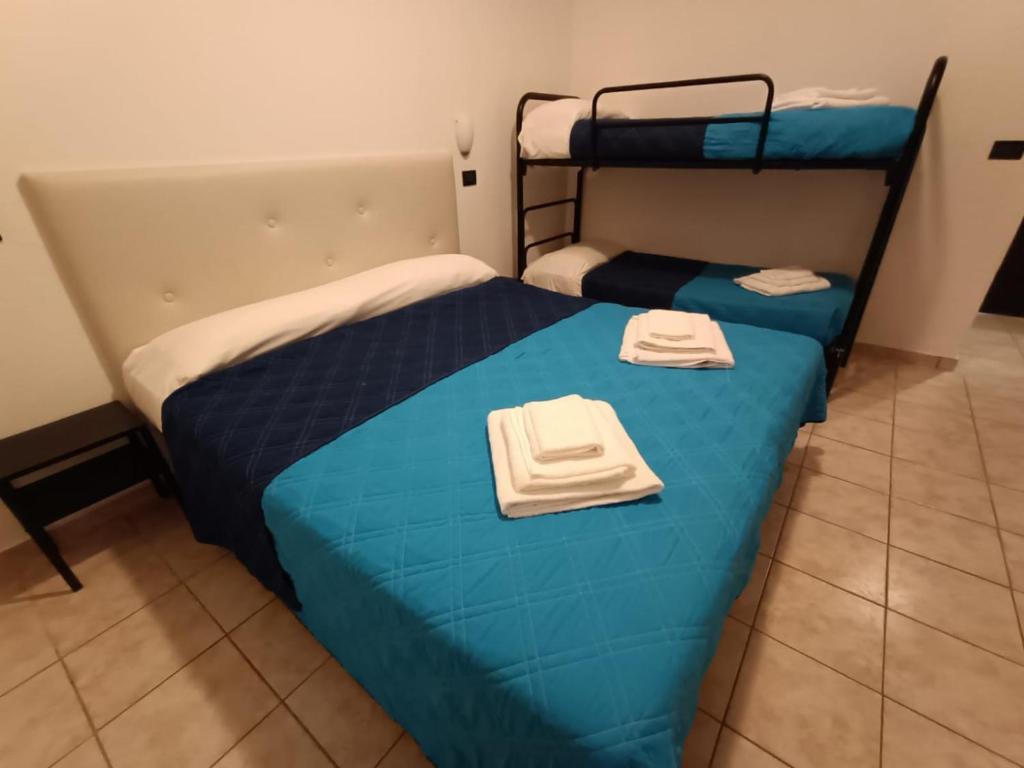 Postel nebo postele na pokoji v ubytování Hotel La Torre
