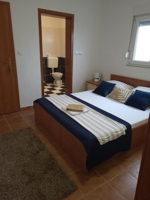 Posteľ alebo postele v izbe v ubytovaní Apartments Bralic
