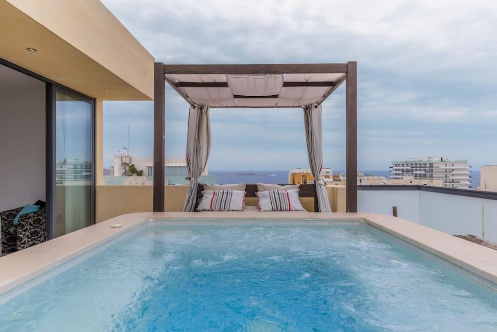 a swimming pool on the roof of a house at Unique penthouse with private pool & sea view in St. Paul's Bay