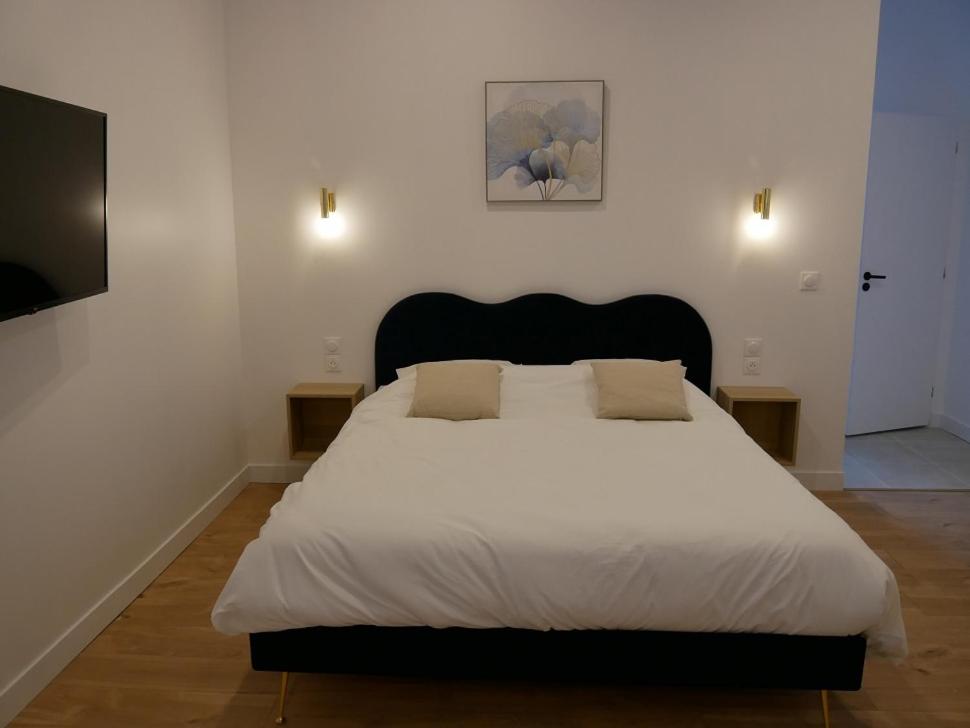 Ένα ή περισσότερα κρεβάτια σε δωμάτιο στο Clos de la Providence Chambres d'hôtes et Spa