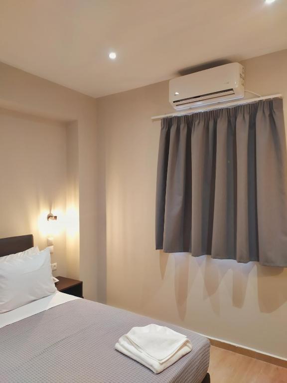 Postel nebo postele na pokoji v ubytování New Amaryllis Hotel