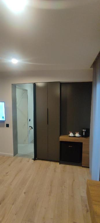 TV a/nebo společenská místnost v ubytování Garden Lounge Hotel