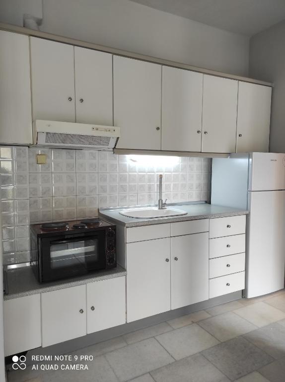 Kuchyň nebo kuchyňský kout v ubytování Iris House