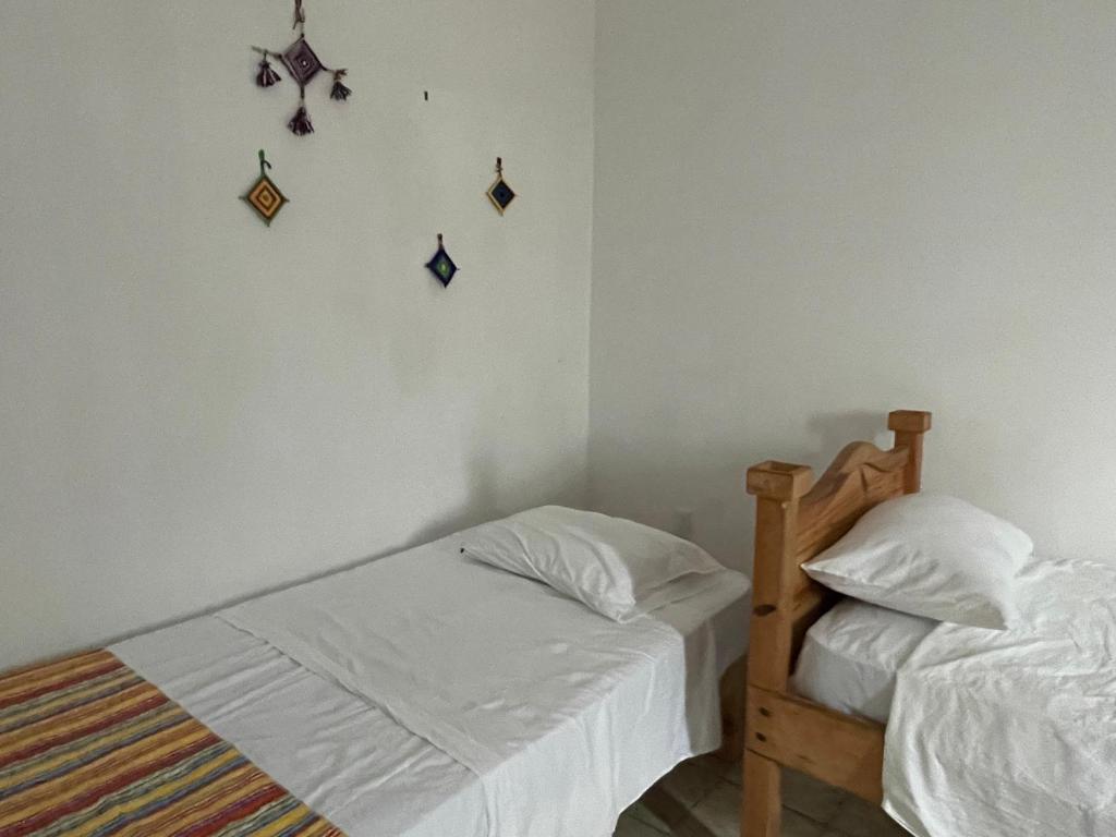 Postel nebo postele na pokoji v ubytování Vive Alegria Hostel