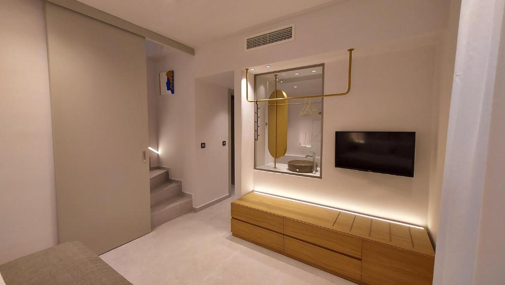 TV a/nebo společenská místnost v ubytování Kynara Elegant Living