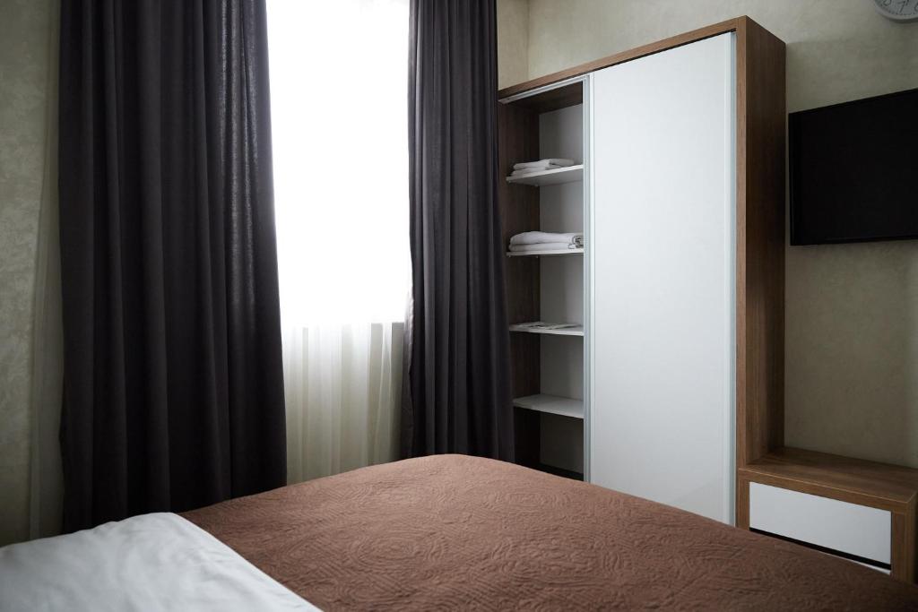 Postel nebo postele na pokoji v ubytování HOTEL LORD