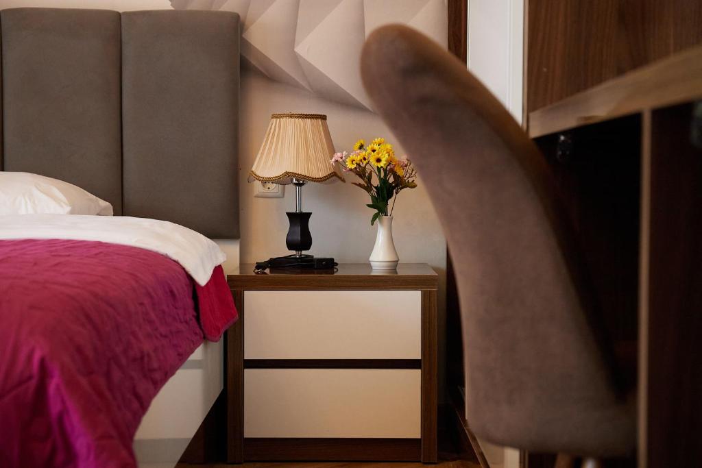 Postel nebo postele na pokoji v ubytování HOTEL LORD