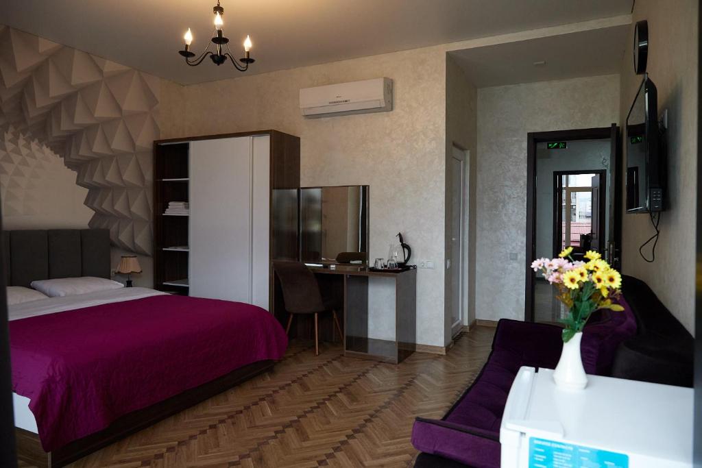 Postel nebo postele na pokoji v ubytování HOTEL LORD