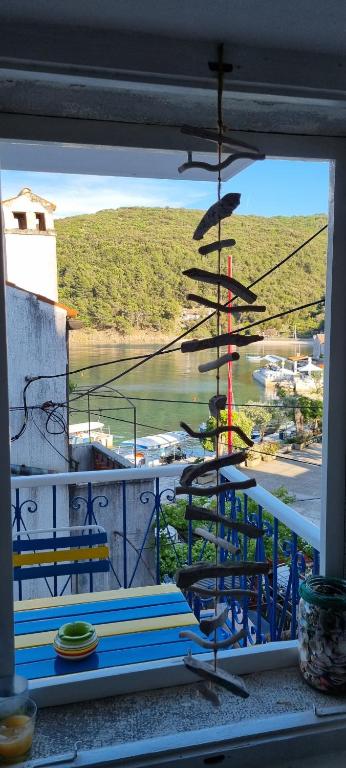 a view of a balcony with a view of a marina at Sea La Vie in Valun