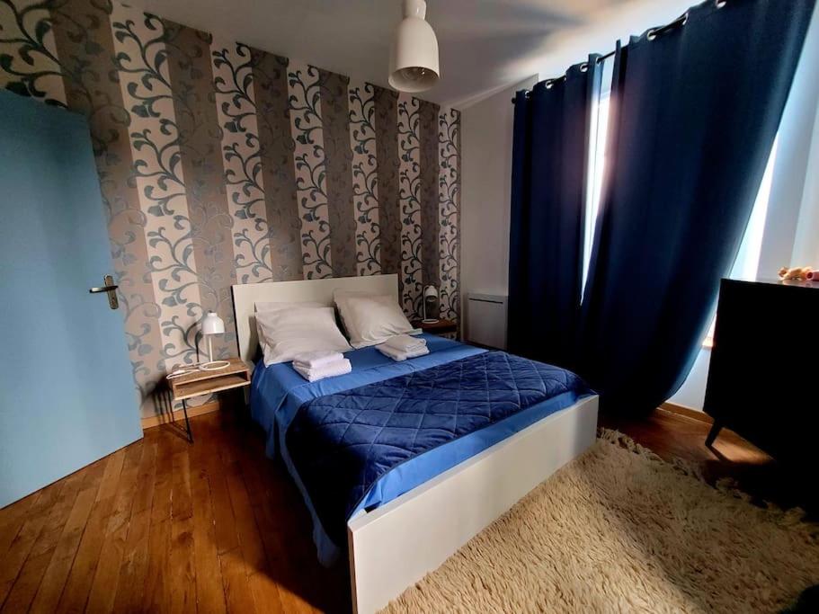 Postel nebo postele na pokoji v ubytování Appartements CDG JOIGNY