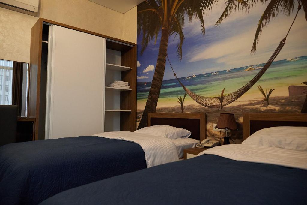 Postel nebo postele na pokoji v ubytování HOTEL LORD