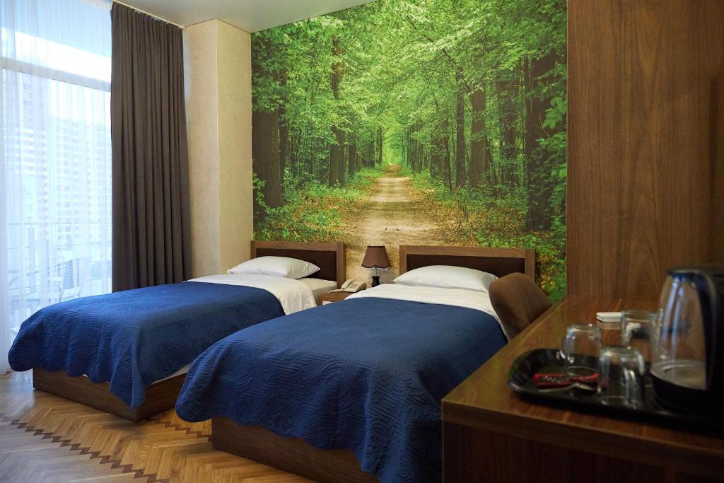 Postel nebo postele na pokoji v ubytování HOTEL LORD