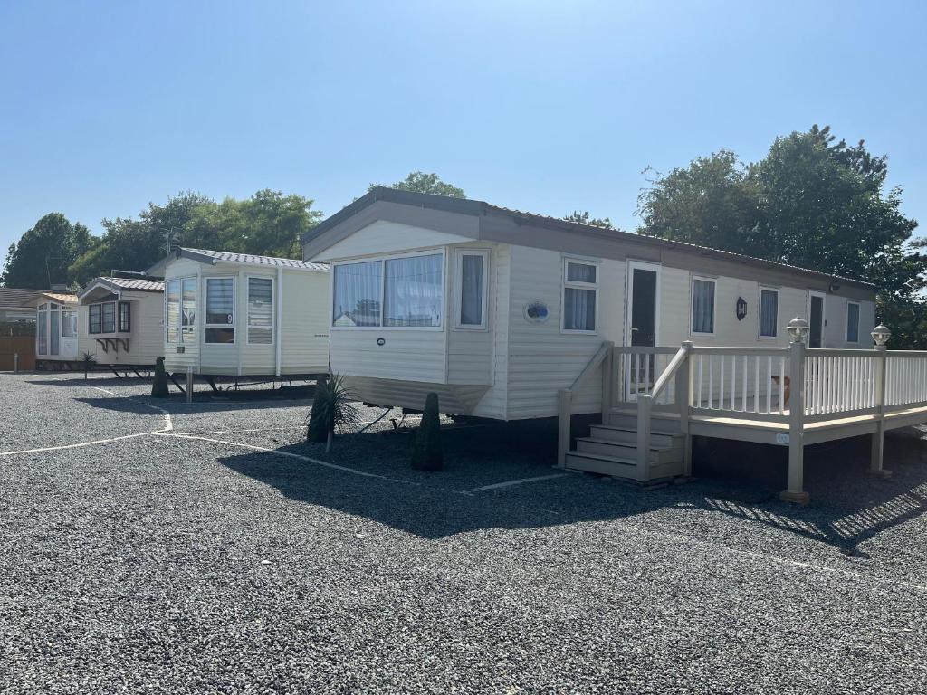 a mobile home parked in a parking lot at Marsh Farm Holiday Park in Great Yarmouth