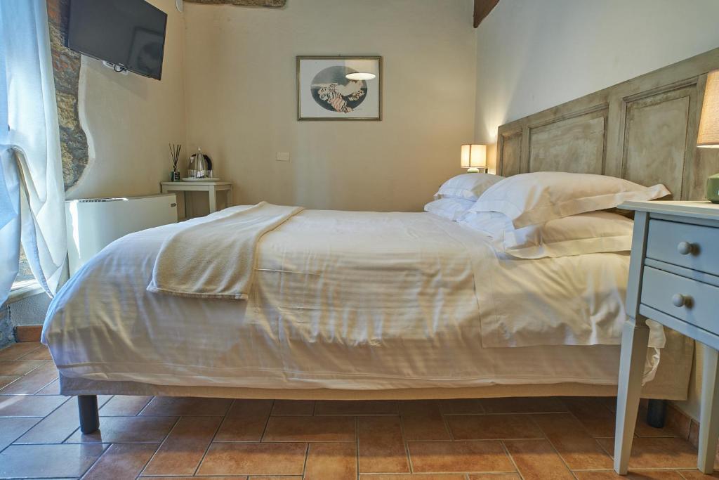 A bed or beds in a room at Podere Gli Olmi