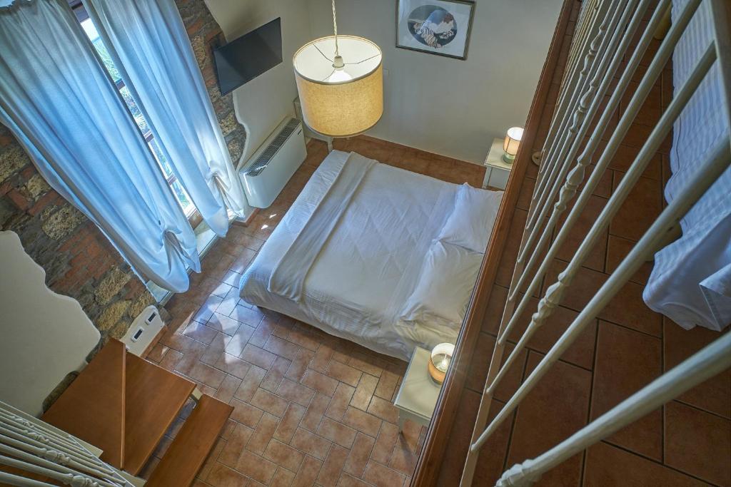 A bed or beds in a room at Podere Gli Olmi