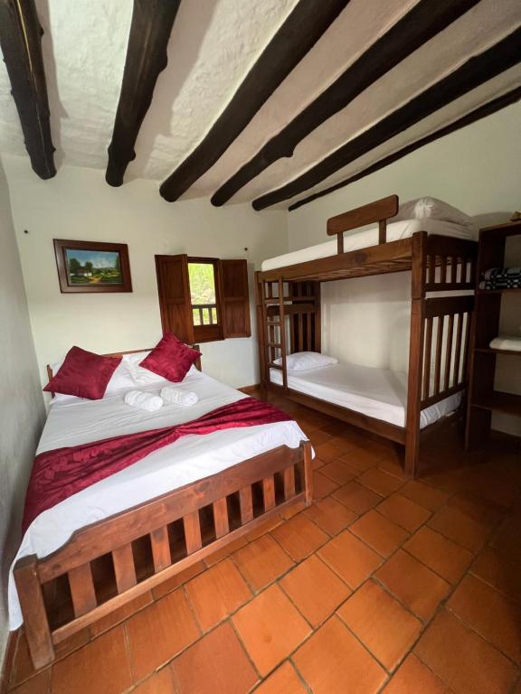 Postel nebo postele na pokoji v ubytování Hostal Villa San Rafael