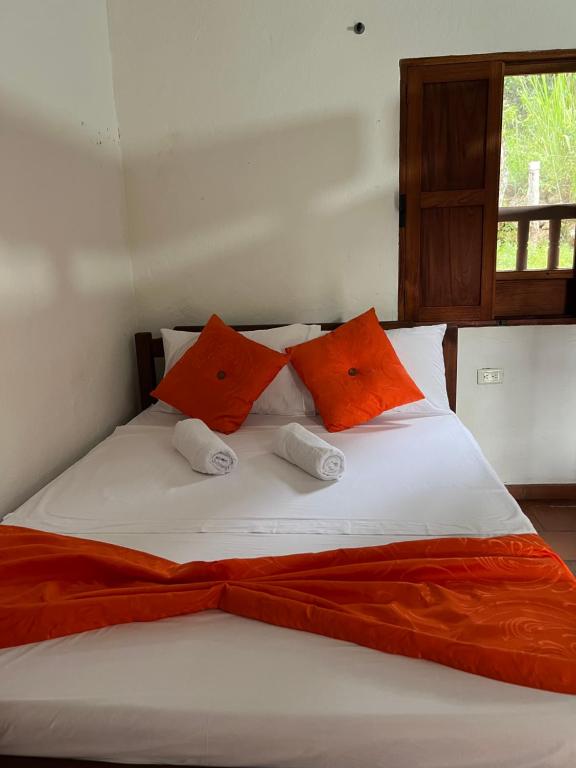 Postel nebo postele na pokoji v ubytování Hostal Villa San Rafael