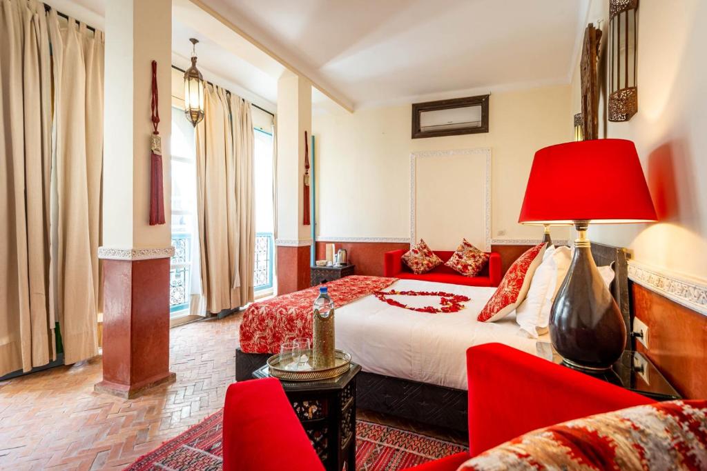 Postel nebo postele na pokoji v ubytování Riad L'orange Bleue