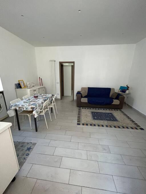 a living room with a couch and a table at casa Vesuvio in Cercola
