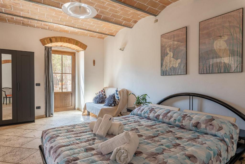 Postel nebo postele na pokoji v ubytování Le Volte ( Matrimoniale esclusiva più divani letto)