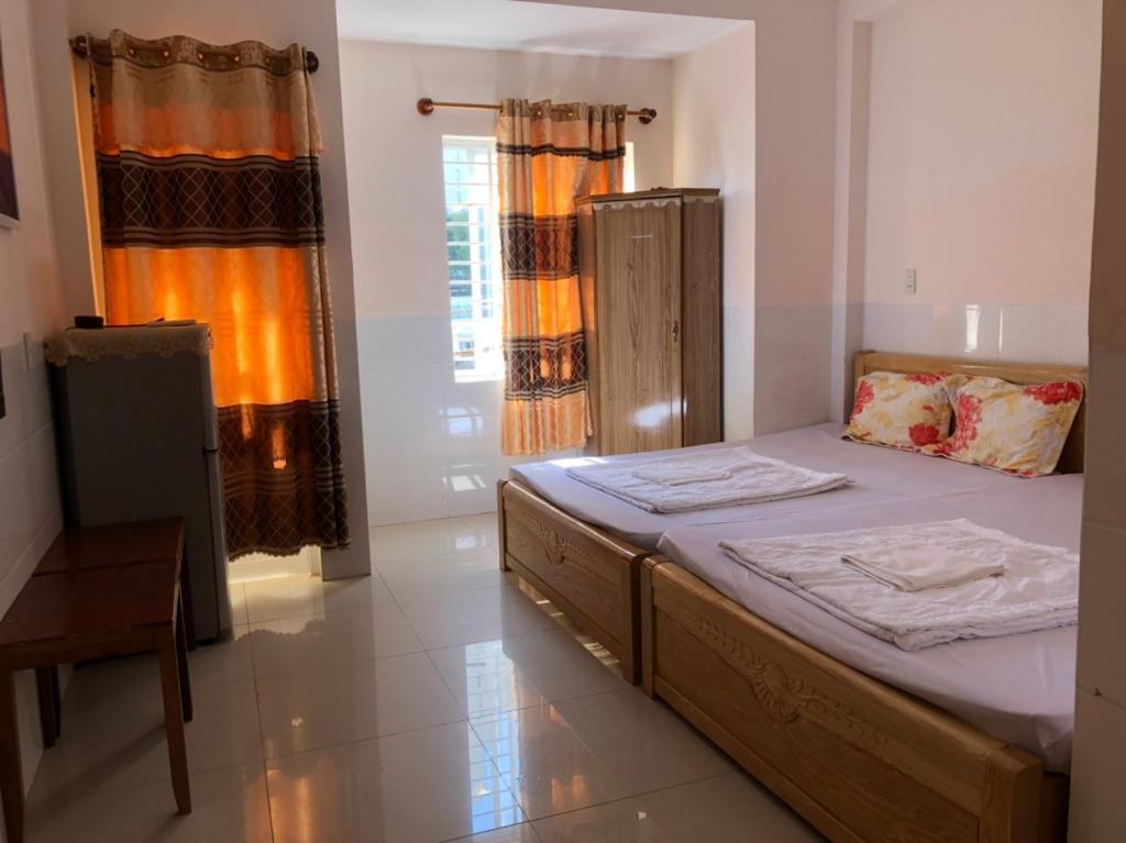 Postel nebo postele na pokoji v ubytování Cao Hung Hotel
