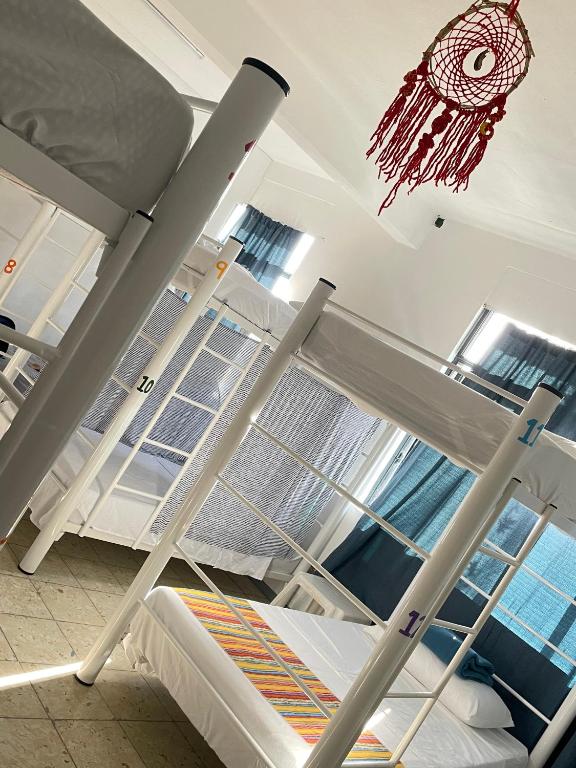 Postel nebo postele na pokoji v ubytování Vive Alegria Hostel