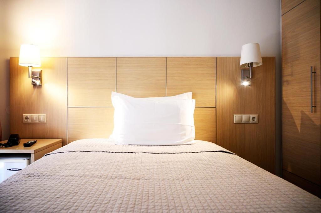 Postel nebo postele na pokoji v ubytování Hotel El Greco